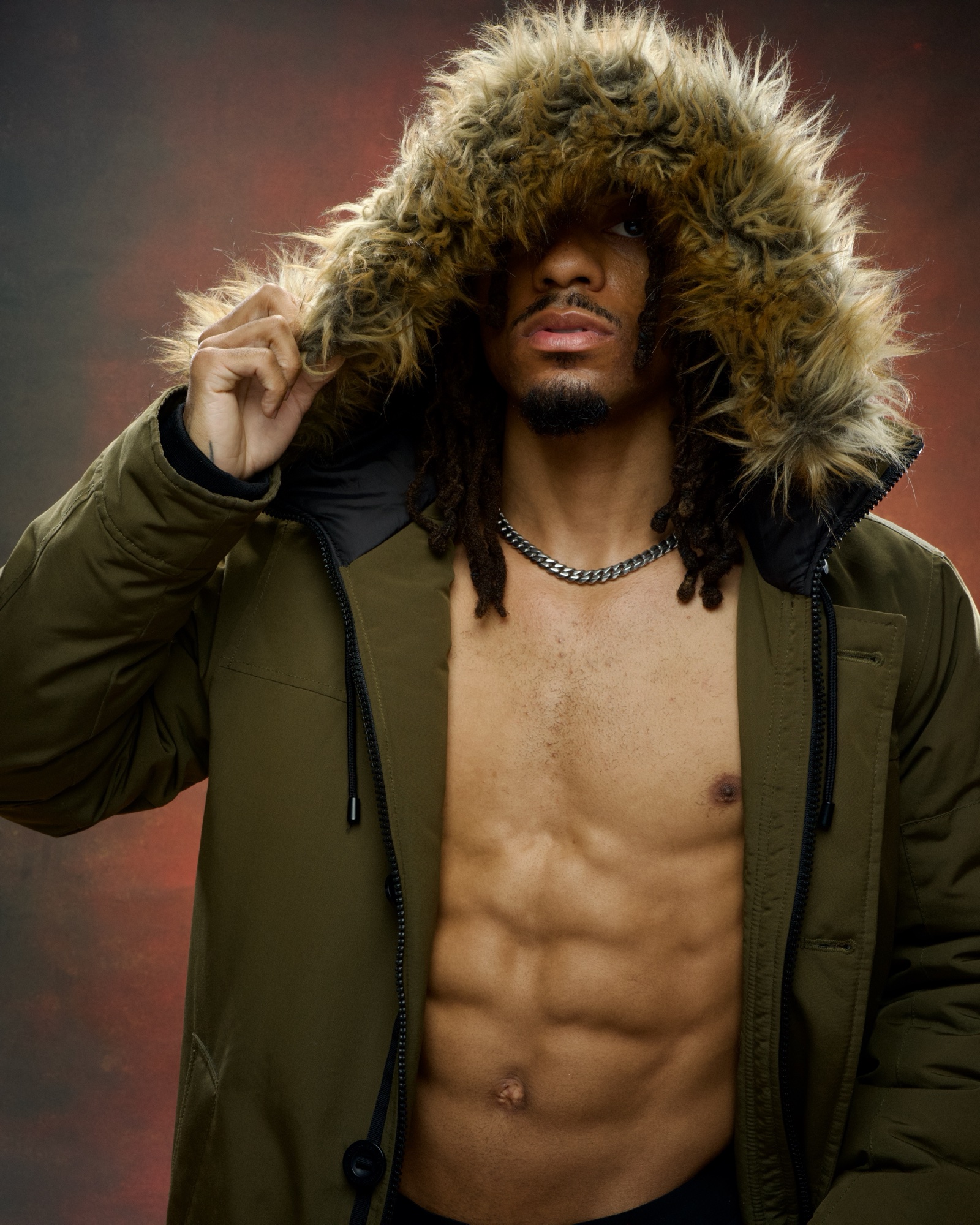 Boxer Jordan King, fur-lined parka, studio portrait
